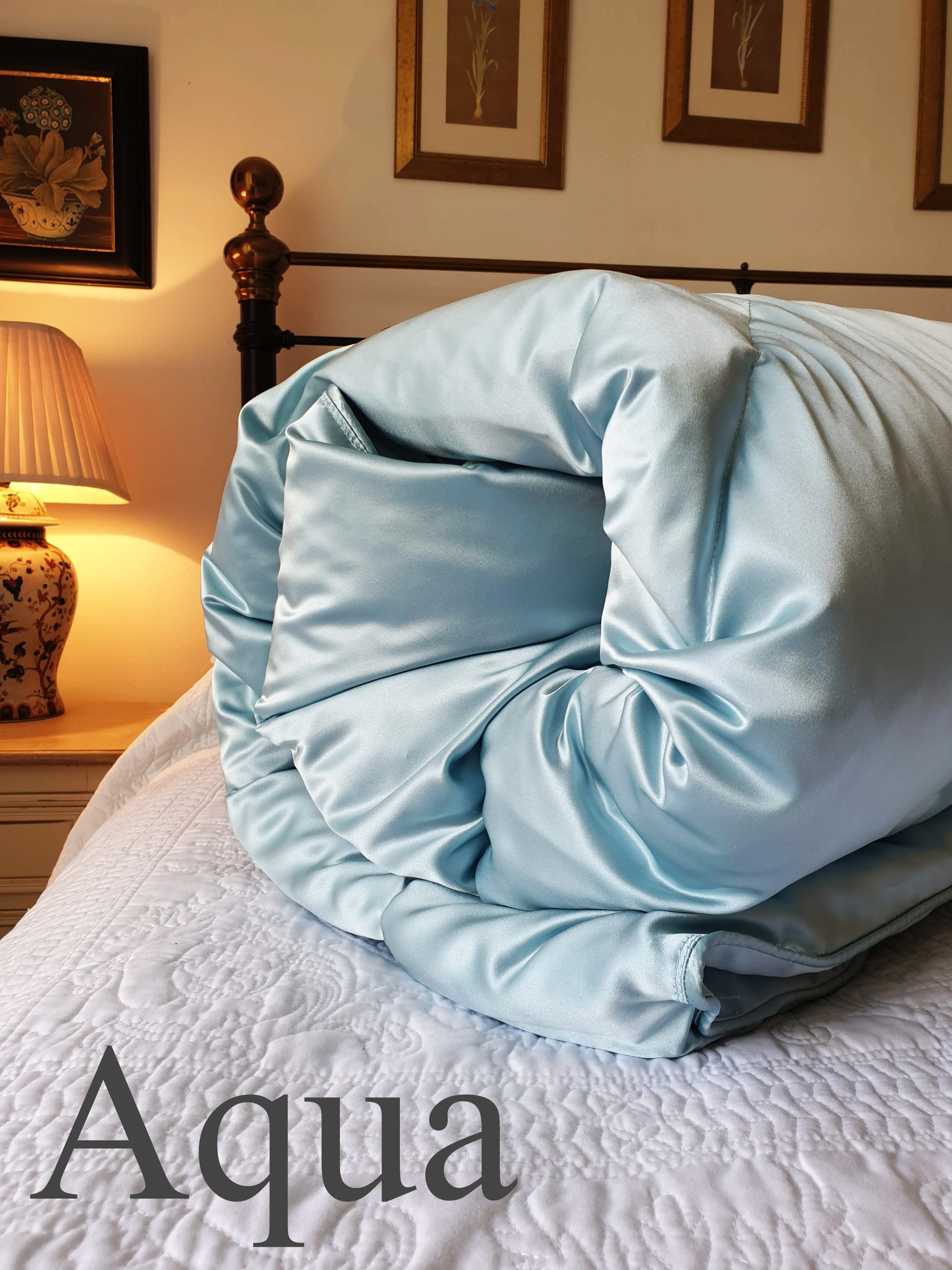 Aqua blue silk eiderdown in bedroom 